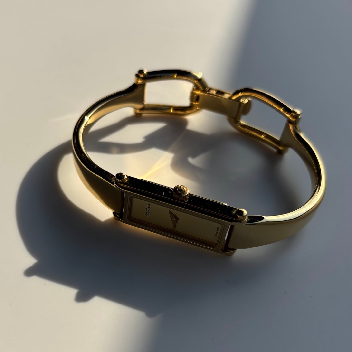 Gucci 1990s Gold Dial Rectangular Gold Plated Bangle Watch