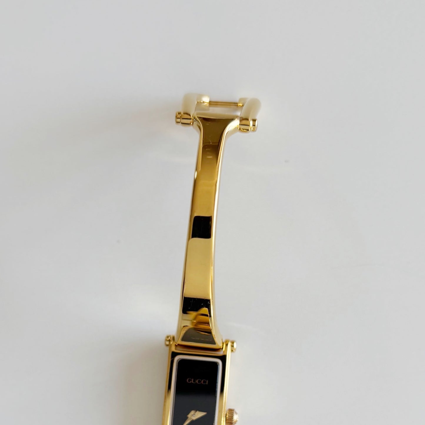 Gucci 1990s Black Rectangular Dial Gold Plated Bangle Watch