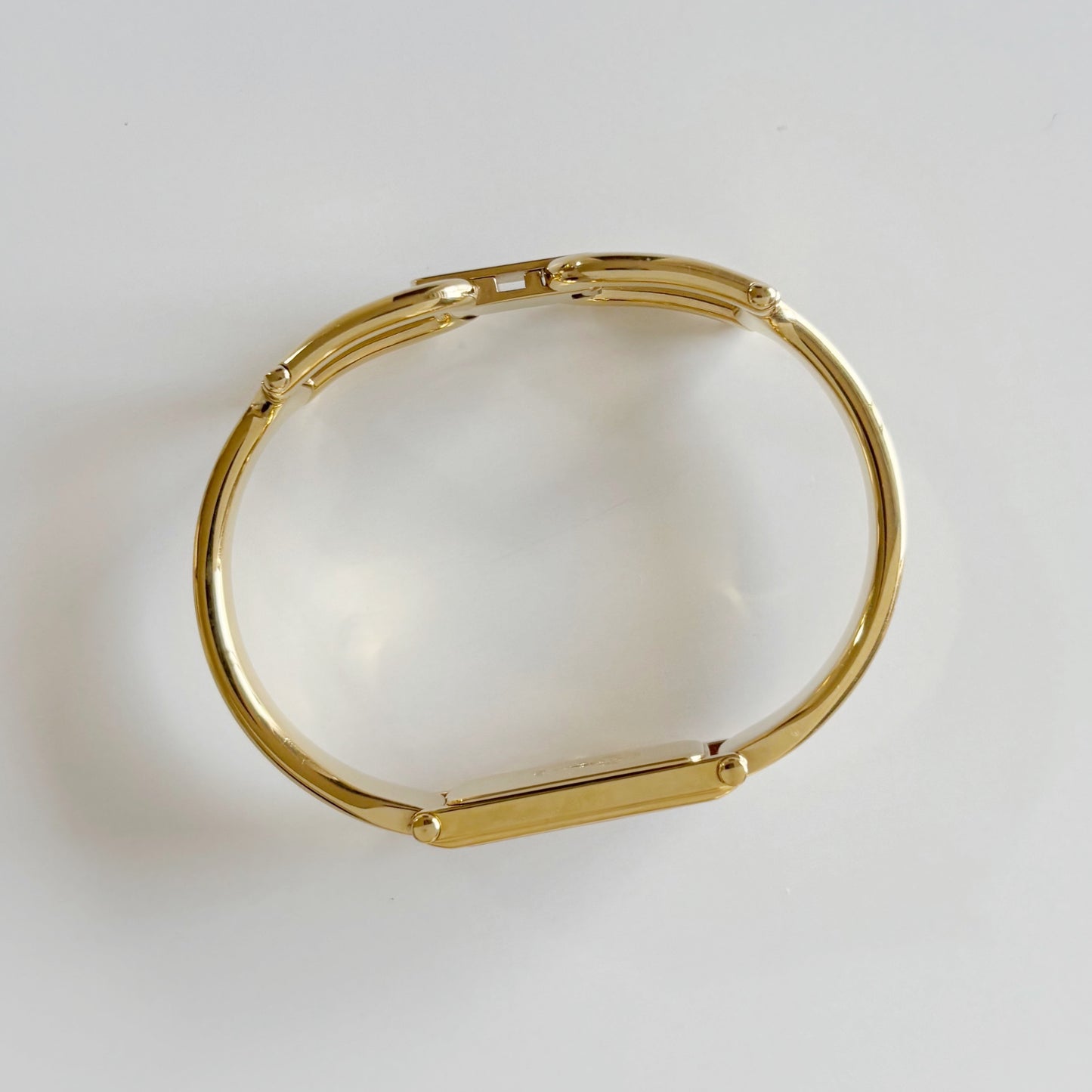 Gucci 1980s Rectangular Gold Dial Gold Plated Bangle Watch
