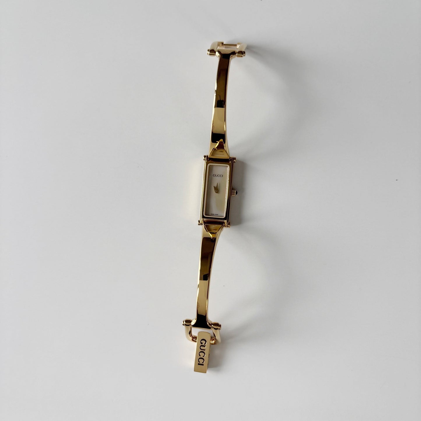 Gucci 1990s Seashell Rectangular Dial Gold Plated Bangle Watch