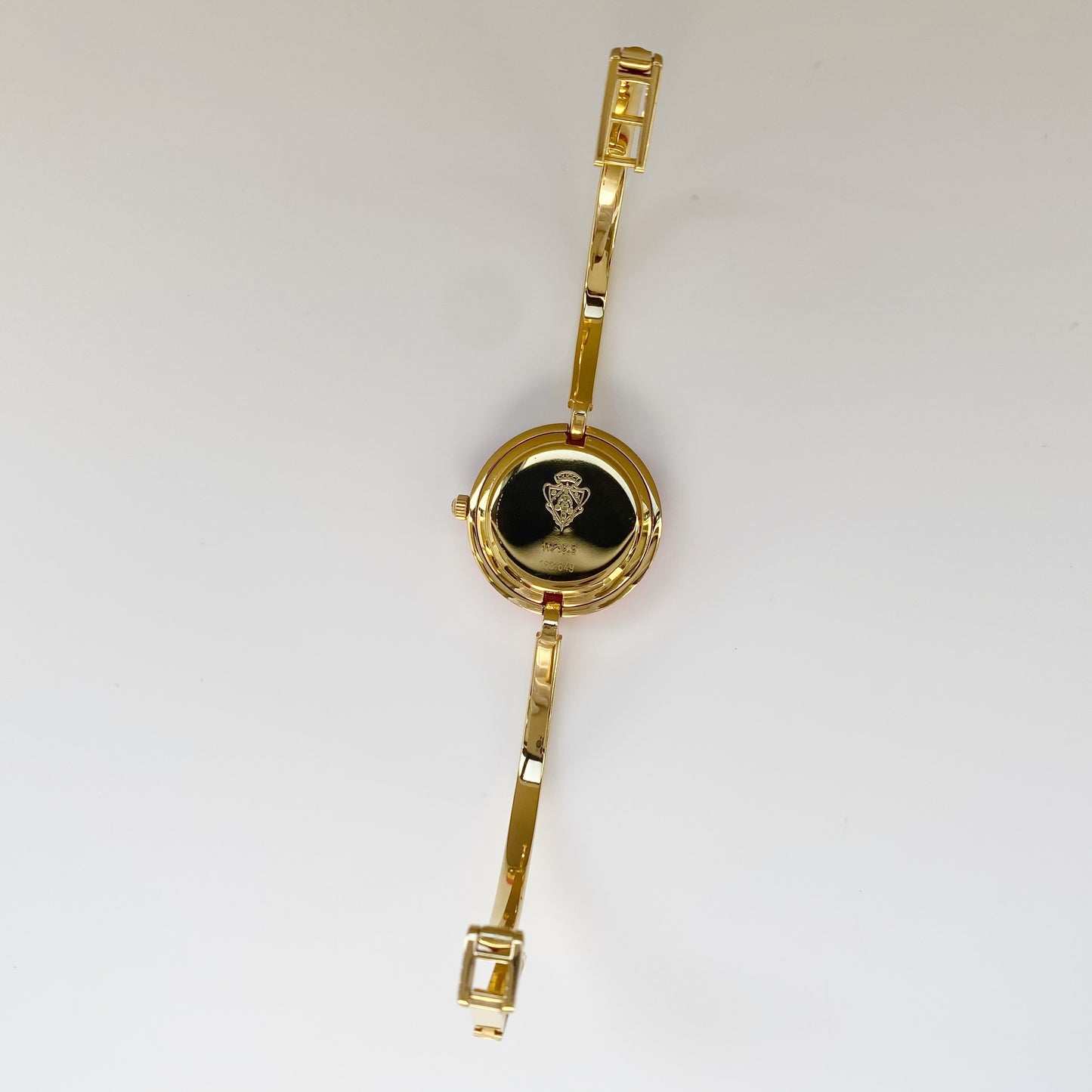 Gucci 1990s Interchangeable Bezel Gold Plated Bangle Watch with 12 bezels, case