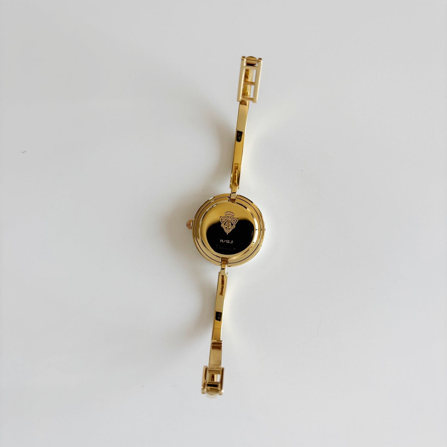 Gucci 1990s Interchangeable Bezel Gold Plated Bangle Watch with 12 bezels, case