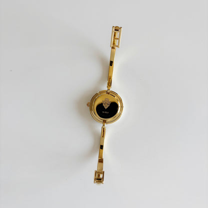 Gucci 1990s Interchangeable Bezel Gold Plated Bangle Watch with 12 bezels, case