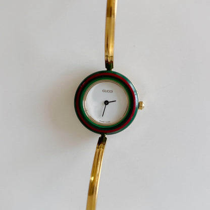 Gucci 1990s Interchangeable Bezel Gold Plated Bangle Watch with 12 bezels, case