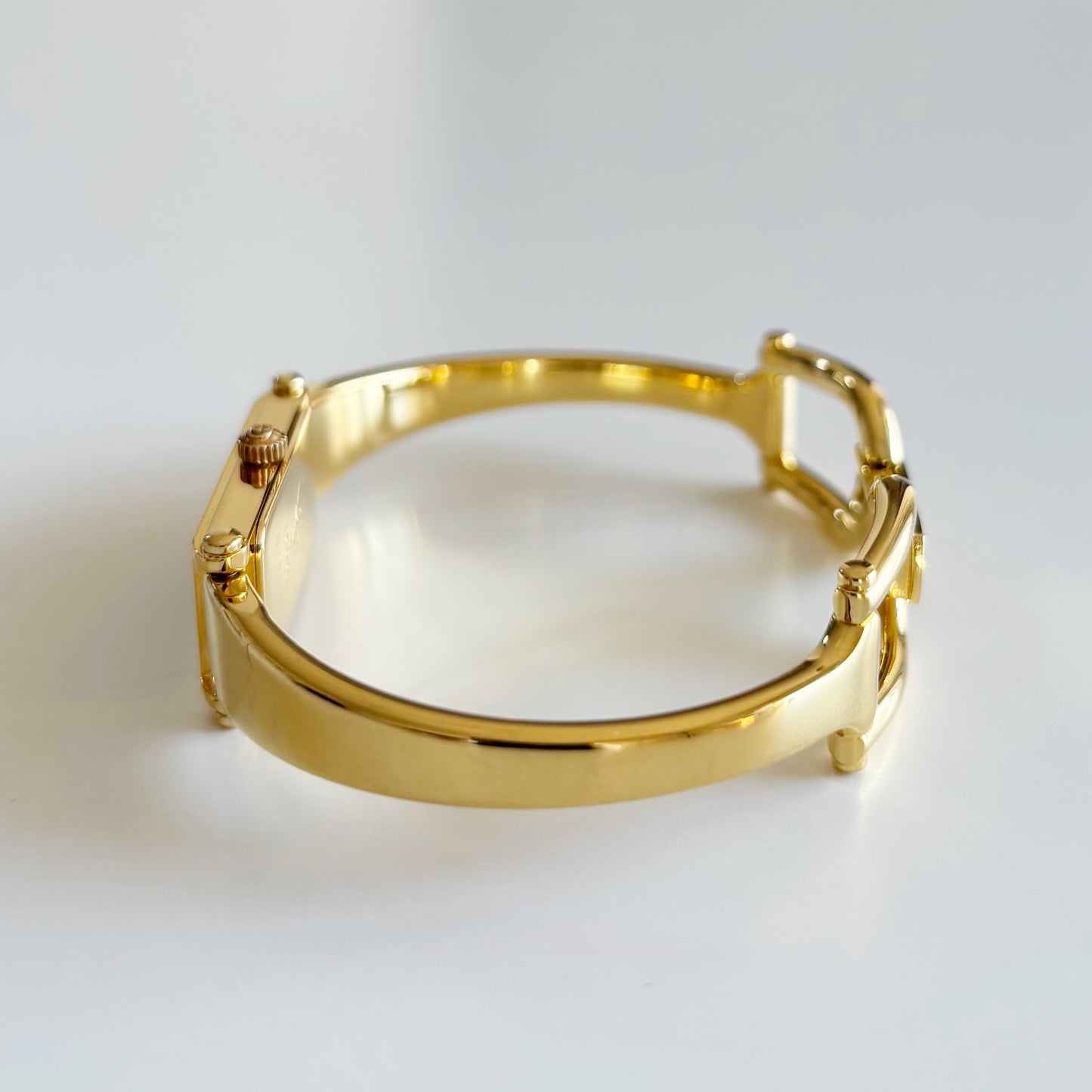 Gucci 1990s Black Rectangular Dial Gold Plated Bangle Watch