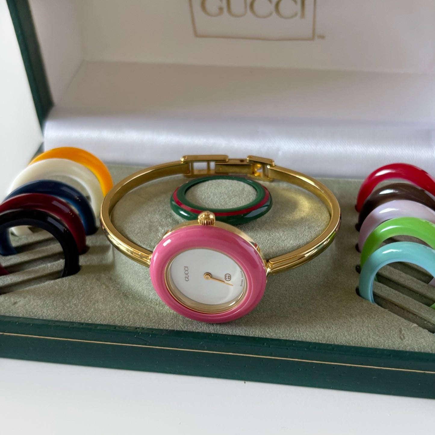 Gucci 1990s Interchangeable Bezel Gold Plated Bangle Watch with 12 bezels, case (Small)