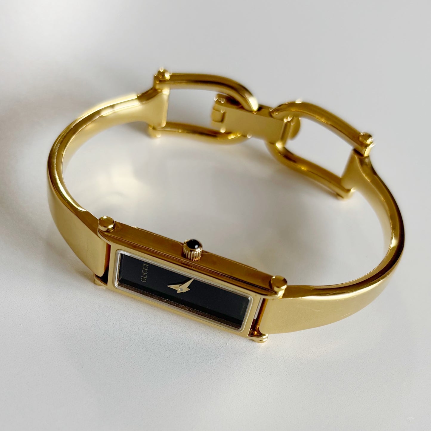 Gucci 1990s Black Dial Rectangular Gold Plated Bangle Watch