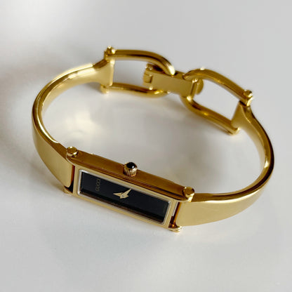 Gucci 1990s Black Dial Rectangular Gold Plated Bangle Watch