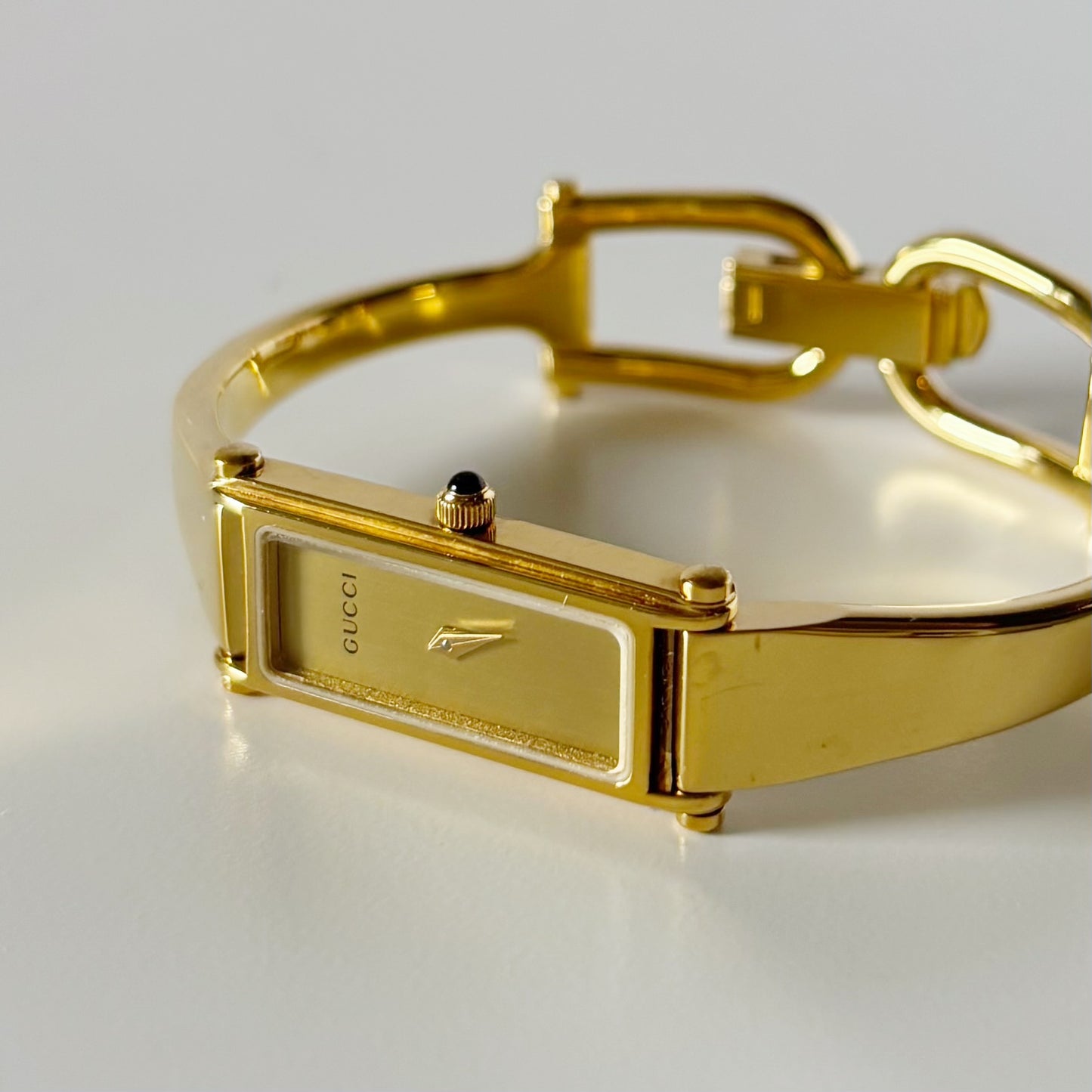 Gucci 1990s Gold Rectangular Dial Gold Plated Bangle Watch