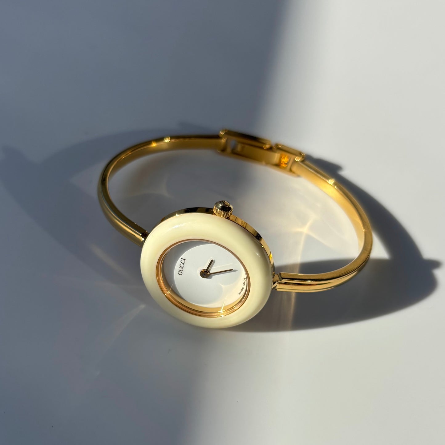 Gucci 1990s Interchangeable Bezel Gold Plated Bangle Watch with 12 bezels, case