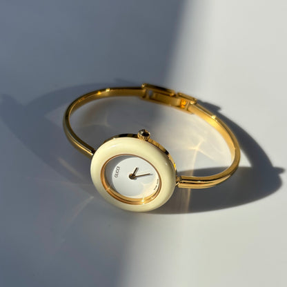 Gucci 1990s Interchangeable Bezel Gold Plated Bangle Watch with 12 bezels, case