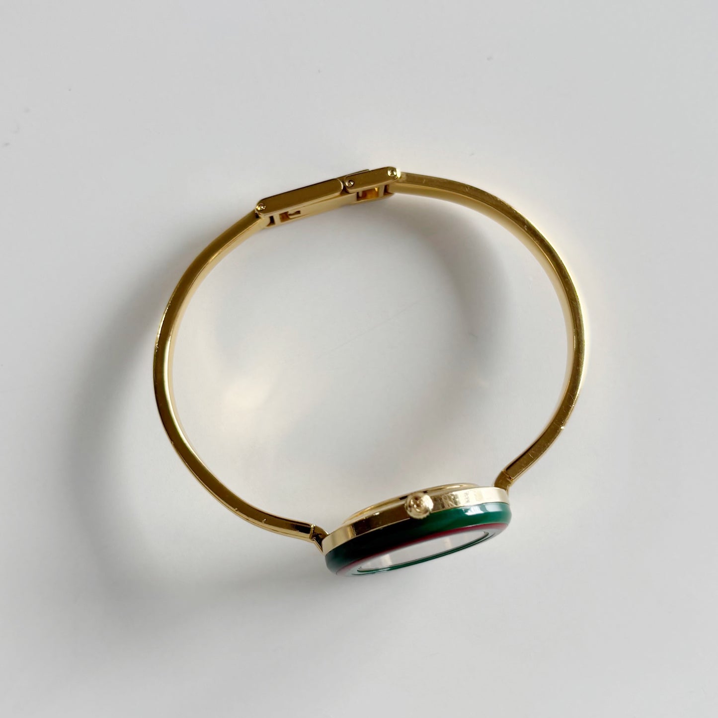 Gucci 1990s Interchangeable Bezel Gold Plated Bangle Watch with 12 bezels, case