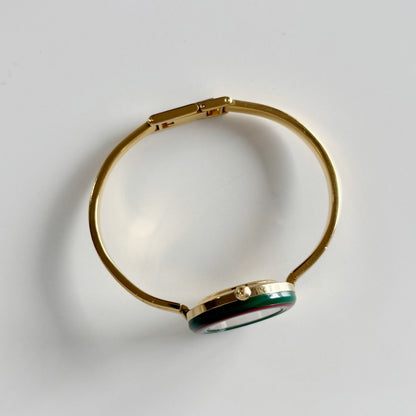 Gucci 1990s Interchangeable Bezel Gold Plated Bangle Watch with 12 bezels, case