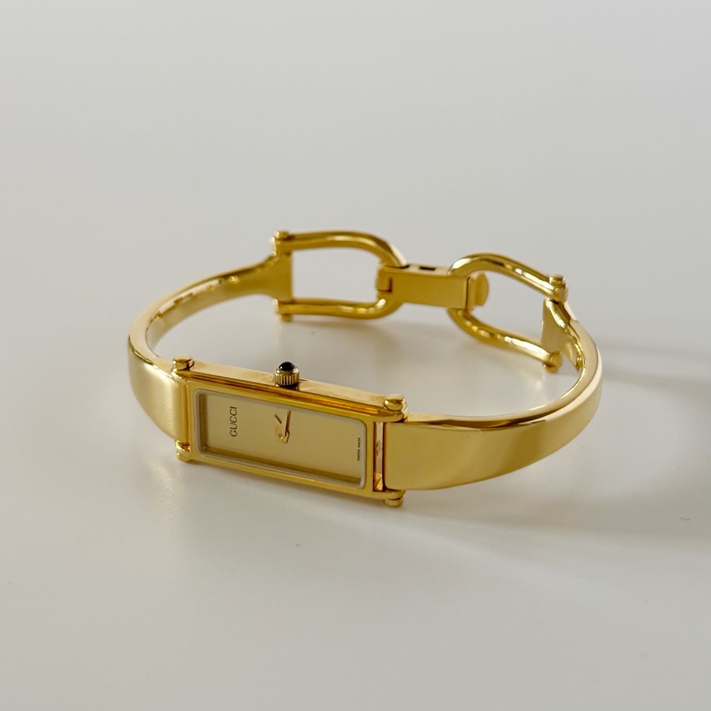 Gucci 1990s Rectangular Gold Dial Gold Plated Bangle Watch