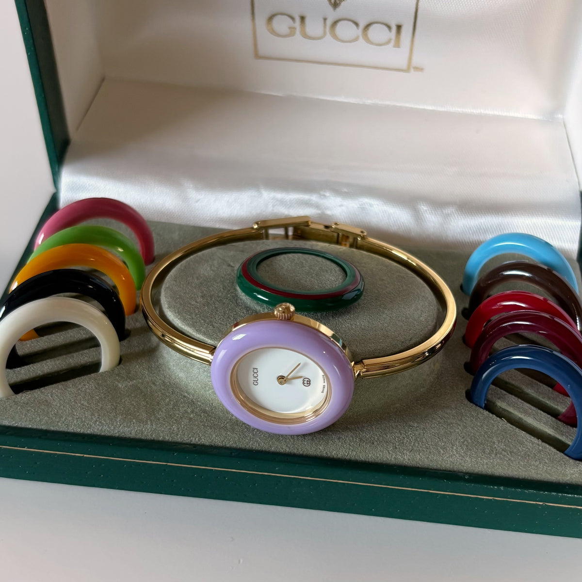 Gucci 1990s Interchangeable Bezel Gold Plated Bangle Watch with 12 bezels, case
