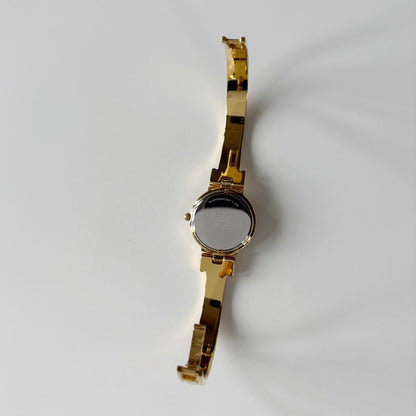 Givenchy 1990s Round Dial Gold Plated Bangle Watch