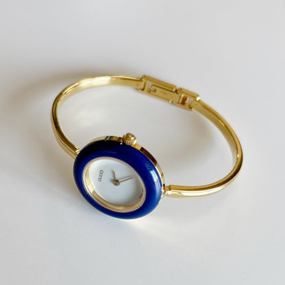 Gucci 1990s Interchangeable Bezel Gold Plated Bangle Watch with 12 bezels, case