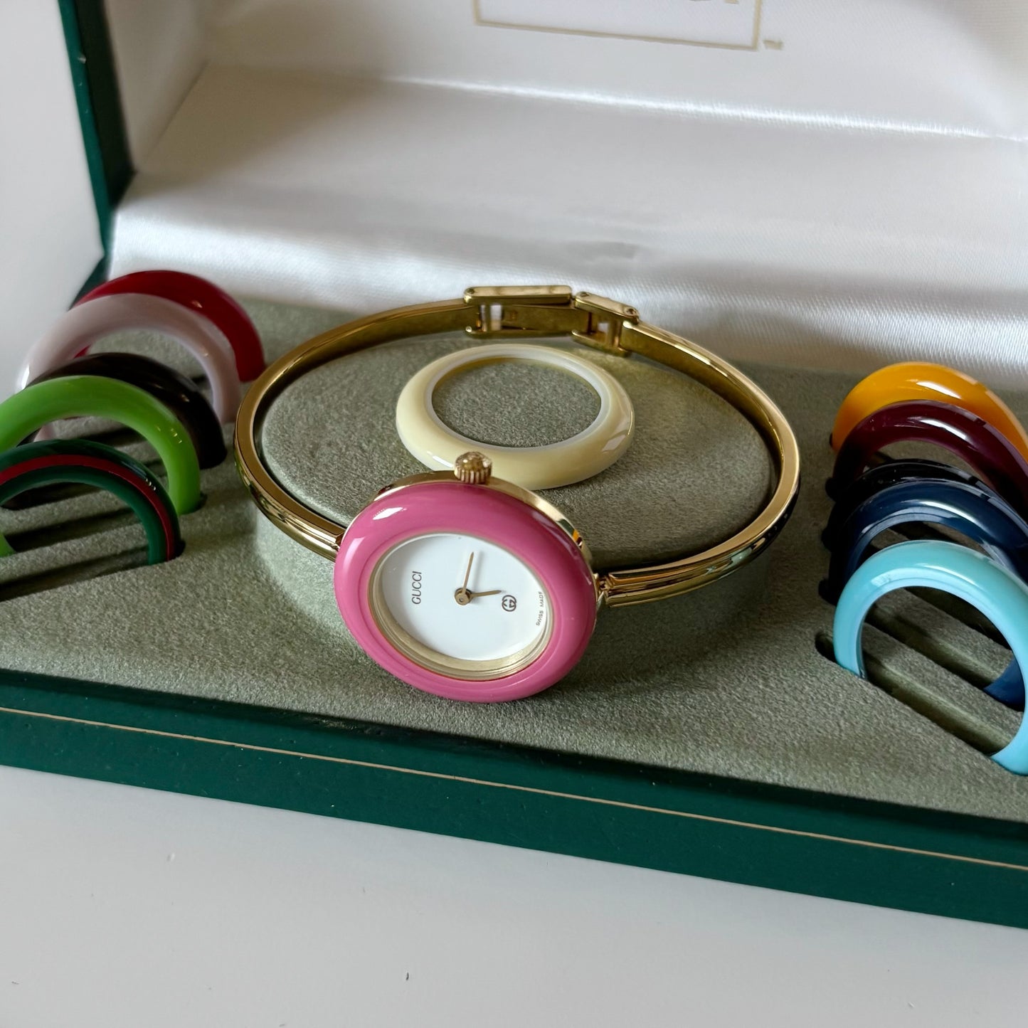 Gucci 1990s Interchangeable Bezel Gold Plated Bangle Watch with 12 bezels, case
