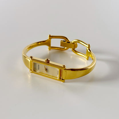 Gucci 1990s Rectangular Seashell Dial Gold Plated Bangle Watch