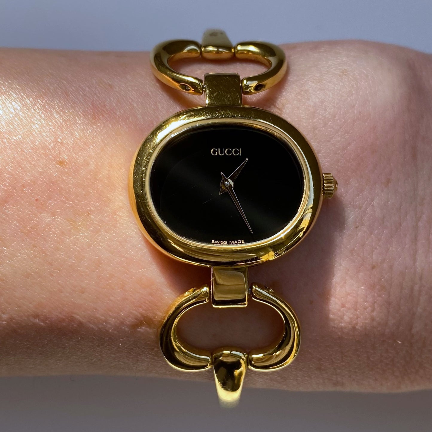 Gucci 1990s Black Dial Oval Gold Plated Bangle Watch