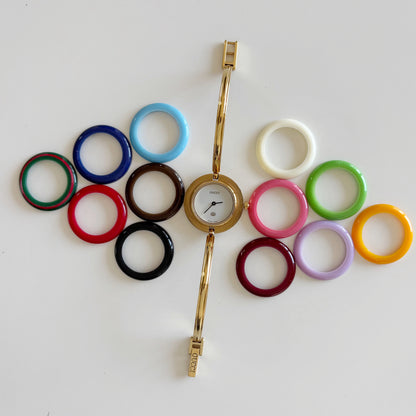Gucci 1980s Interchangeable Bezel Gold Plated Bangle Watch with 12 bezels, case