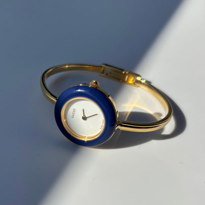 Gucci 1990s Interchangeable Bezel Gold Plated Bangle Watch with 12 bezels, case