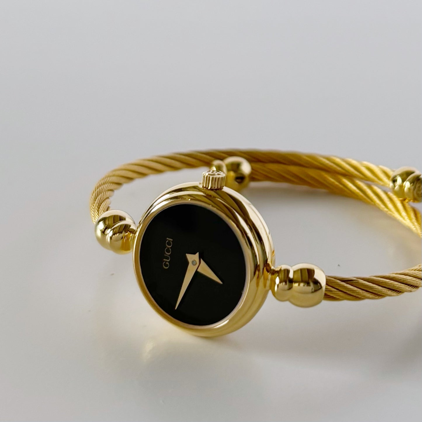 Gucci 1990s Black Dial Gold Plated Cable Band Bangle Watch