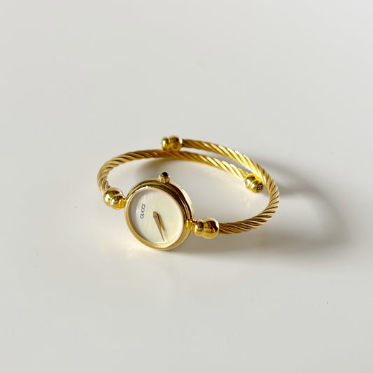 Gucci 1990s Seashell Round Dial Gold-Plated Cable Bangle Watch