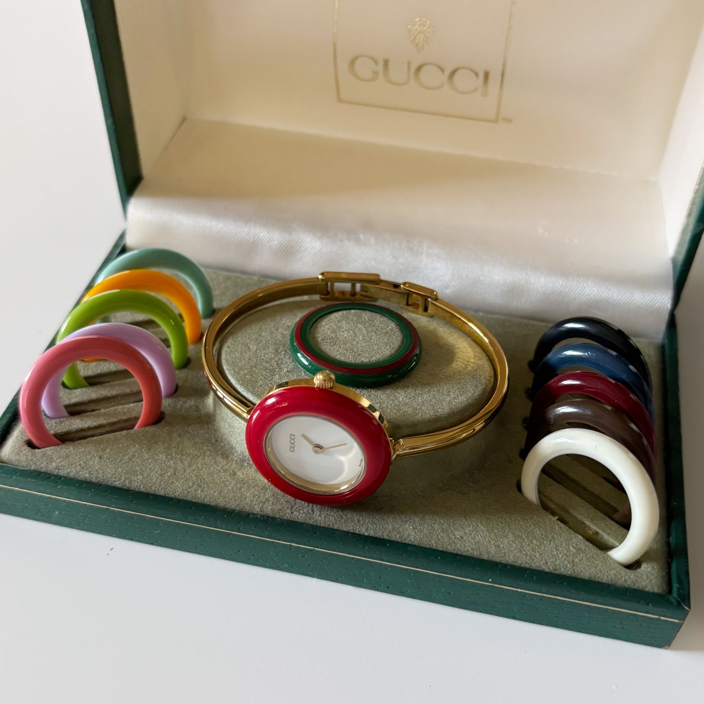 Gucci 1990s Interchangeable Bezel Gold Plated Bangle Watch with 12 bezels, case (Small)