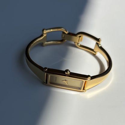 Gucci 1990s Gold Rectangular Dial Gold Plated Bangle Watch