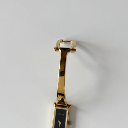Gucci 1990s Black Rectangular Dial Gold Plated Bangle Watch