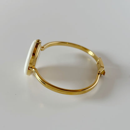 Gucci 1990s Interchangeable Bezel Gold Plated Bangle Watch with 12 bezels, case