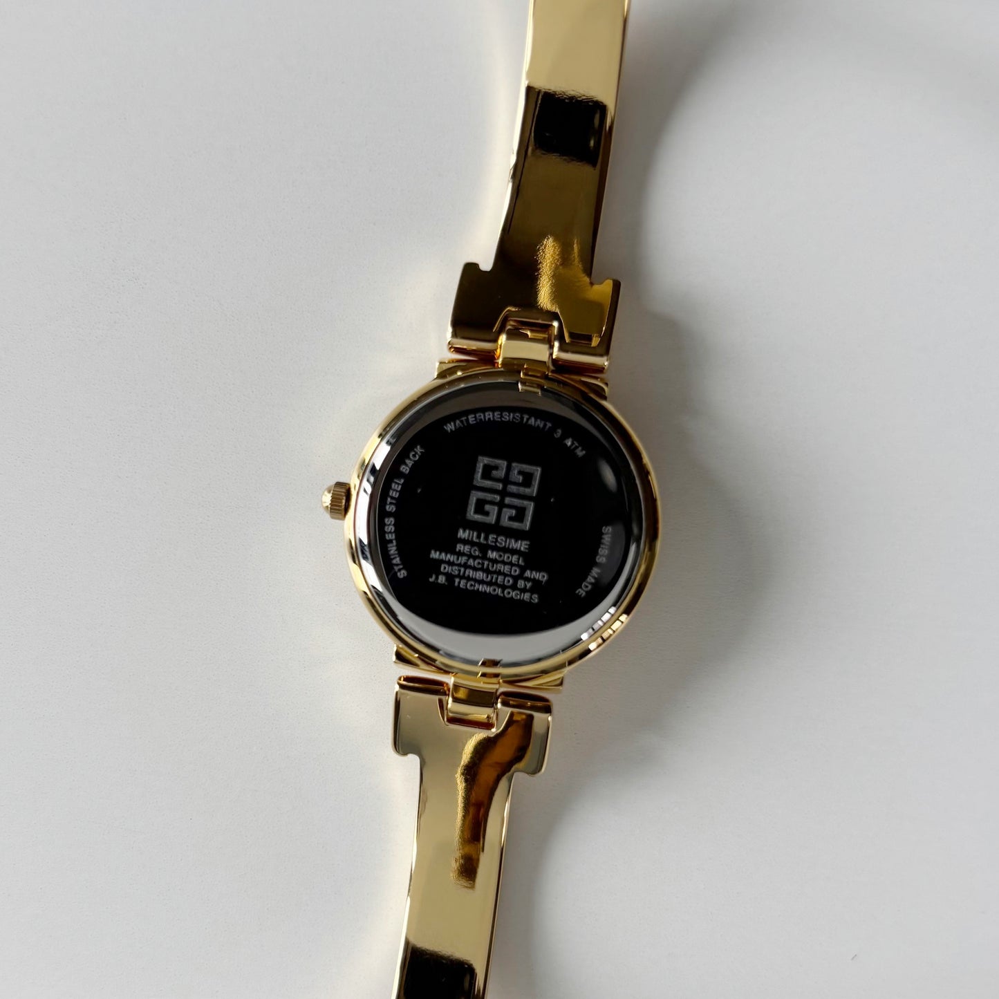 Givenchy 1990s Round Dial Gold Plated Bangle Watch