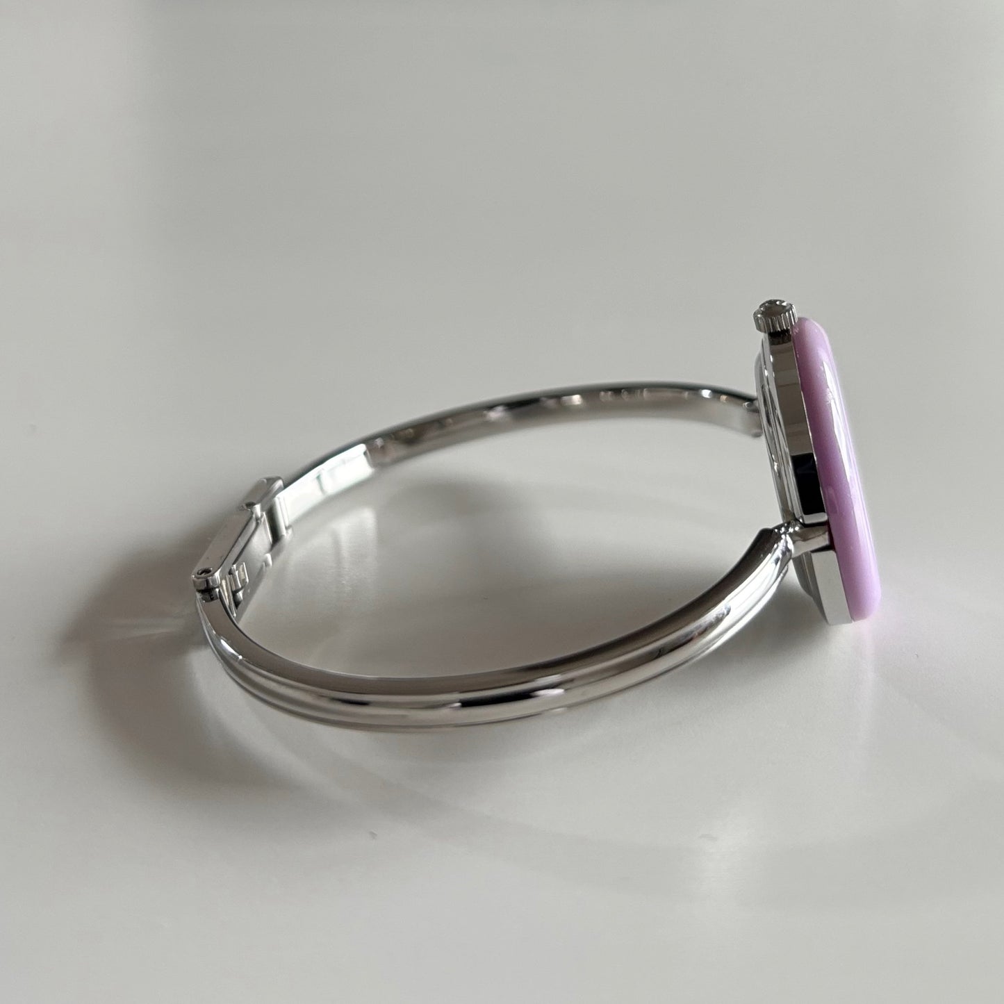 Gucci 1990s Interchangeable Bezel Stainless Steel Bangle Watch with 12 bezels, case