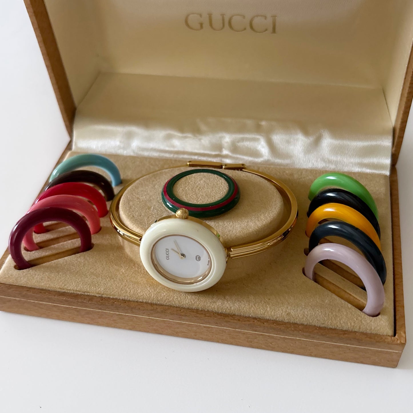 Gucci 1990s Interchangeable Bezel Gold Plated Bangle Watch with 12 bezels, case