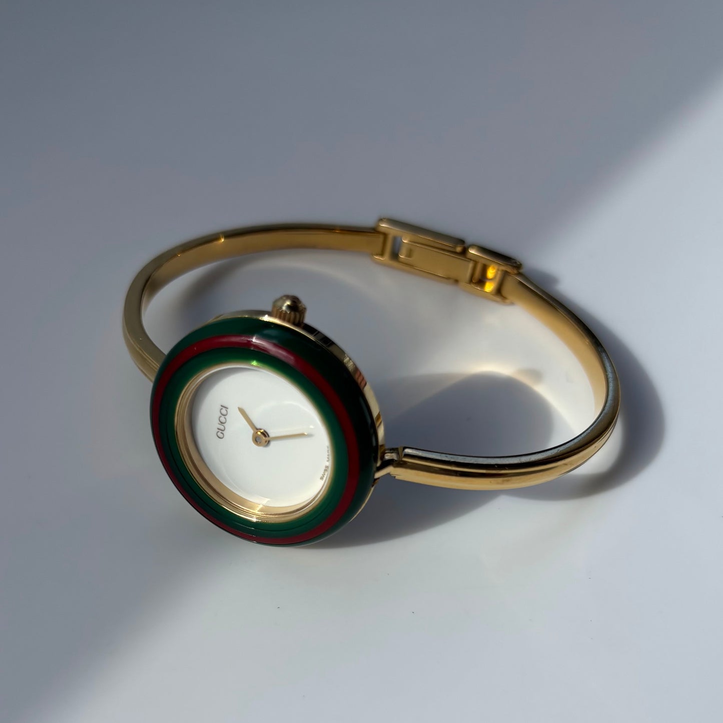 Gucci 1990s Interchangeable Bezel Gold Plated Bangle Watch with 12 bezels, case