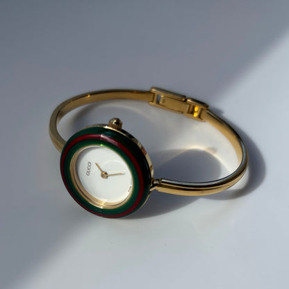 Gucci 1990s Interchangeable Bezel Gold Plated Bangle Watch with 12 bezels, case