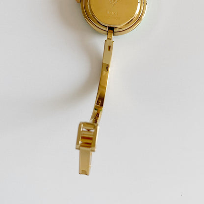 Gucci 1990s Interchangeable Bezel Gold Plated Bangle Watch with 12 bezels, case (Small)