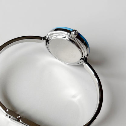 Gucci 1990s Interchangeable Bezel Silver Stainless steel Bangle Watch with 12 bezels, case