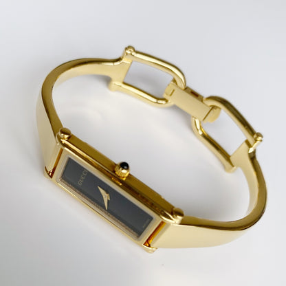 Gucci 1990s Black Dial Rectangular Gold Plated Bangle Watch