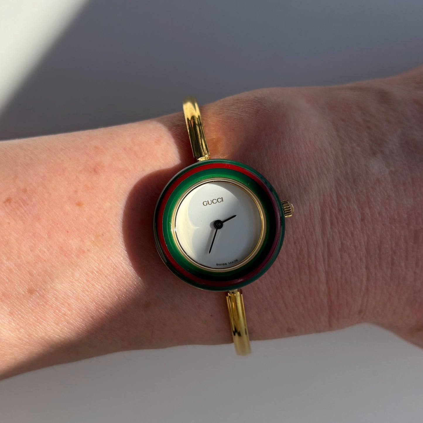 Gucci 1990s Interchangeable Bezel Gold Plated Bangle Watch with 12 bezels, case