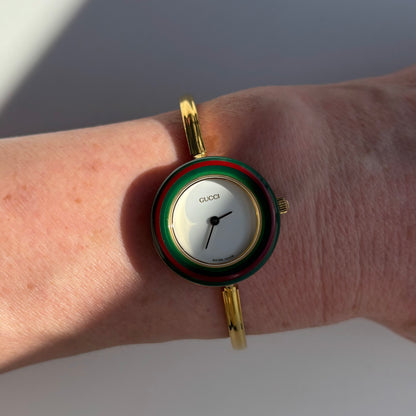 Gucci 1990s Interchangeable Bezel Gold Plated Bangle Watch with 12 bezels, case