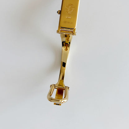 Gucci 1990s Rectangular Gold Dial Gold Plated Bangle Watch