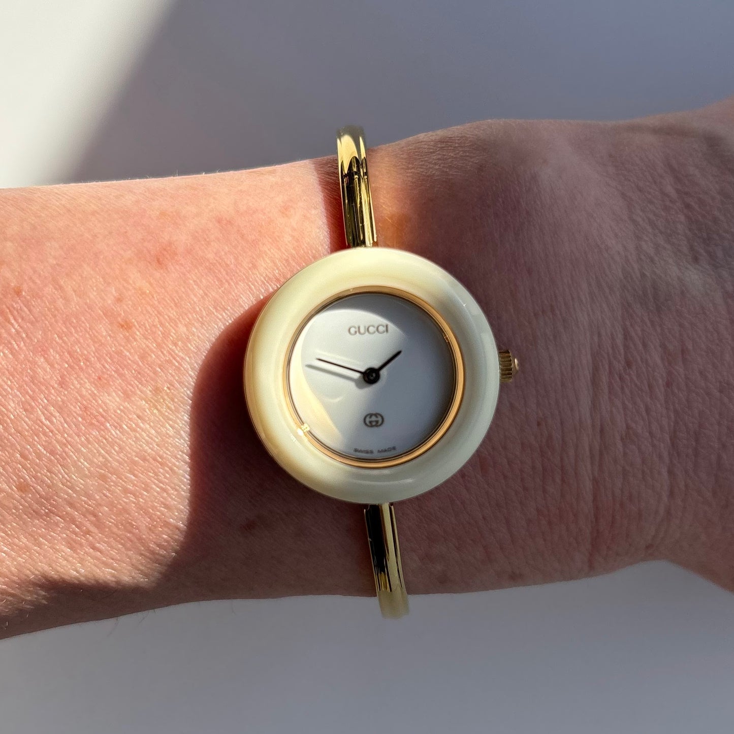 Gucci 1990s Interchangeable Bezel Gold Plated Bangle Watch with 12 bezels, case