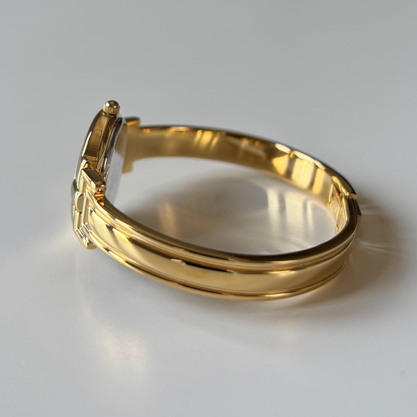 Givenchy 1990s Black Round Dial Gold Plated Bangle Watch