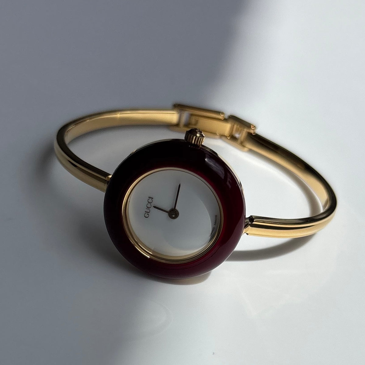 Gucci 1990s Interchangeable Bezel Gold Plated Bangle Watch with 12 bezels, case