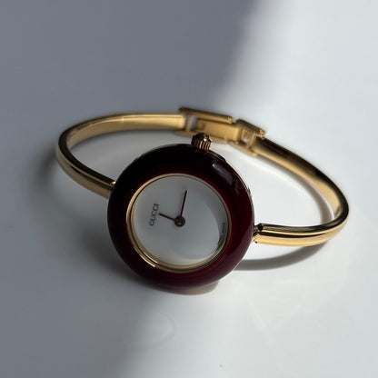 Gucci 1990s Interchangeable Bezel Gold Plated Bangle Watch with 12 bezels, case