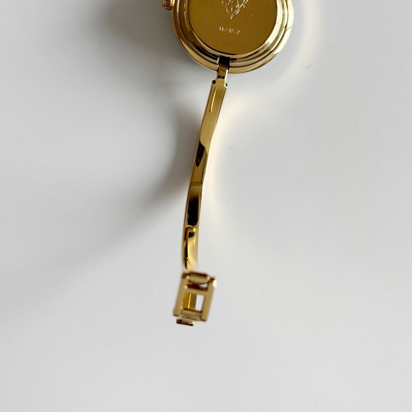 Gucci 1990s Interchangeable Bezel Gold Plated Bangle Watch with 12 bezels, case