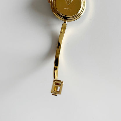 Gucci 1990s Interchangeable Bezel Gold Plated Bangle Watch with 12 bezels, case