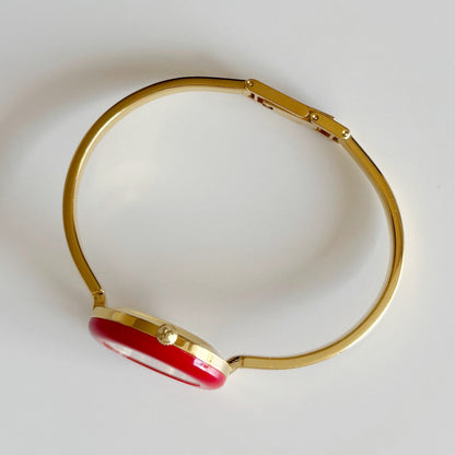 Gucci 1990s Interchangeable Bezel Gold Plated Bangle Watch with 12 bezels, case